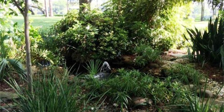 Bubbling Fountain Garden Across from Home Entry and Portico