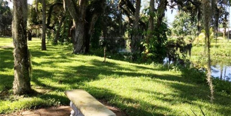 Stone Bench perched above Caloosahatchee River Channel