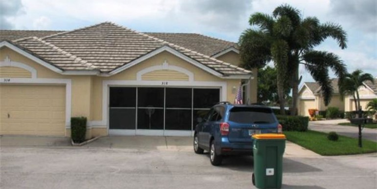 Front of this South-facing Villas has an attached 2-car garage w